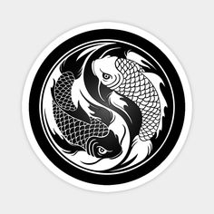 two koi fish in a circle with black and white designs on the back side