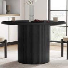 a black table with white chairs around it