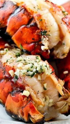 grilled lobsters with garlic and herbs on a plate