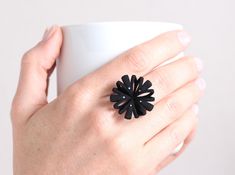 For sure you make a statement with this large floral design ring. This elegant black blossom is an eye-catcher. It would be the perfect match for a witch outfit at the next Halloween pary. Although it's a big ring the comfortable formed ring band makes it pleasant to wear. Not just for Halloween, the ring is a perfect accessory for a day to day outfit or the bloom to an elegant evening dress. The ring is 3d printed in nylon. To receive the highest of quality, I design the 3D templates and send t Black Statement Ring, Contemporary Jewelry Rings, 3d Templates, Goth Ring, Halloween Ring, Witch Outfit, Contemporary Ring, Big Rings, Modern Ring