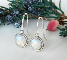 ~  Genuine Rainbow Moonstone ~  Natural, Earth Mined ~  Lots of blue flash ~  Gemstone Size: 8mm  ~  Earring Size: M to L ~  Recycled Sterling Silver ~  Beautiful every day earrings ~  Sparkly, handmade and nickel free ~  June Birthstone Some History and Folklore, courtesy of the Gemological Institute of America:  According to Hindu mythology, Moonstone is made of solidified moonbeams. Many other cultures also associate this gem with moonlight, and it's easy to see why. Its internal structure scatters the light that strikes it, creating a visual effect reminiscent of the full moon shining through a veil of thin, high clouds. Legends say that Moonstone brings good luck to the wearer. Our jewelry is shipped in jewelry gift boxes perfect for gifting. ❤ Gift wrap is available in the cart. You Artisan Moonstone Earrings For Gifts, Silver Moon Shaped Earrings With Gemstone, Nickel-free Moonstone Moon Earrings, Bohemian Moonstone Earrings Nickel-free, Nickel-free Moonstone Spiritual Earrings, High Clouds, Hindu Mythology, Sparkly Earrings, Moonstone Earrings