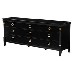 a black dresser with gold handles and drawers