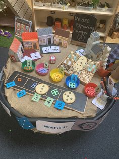 there is a table with many different items on it, including buttons and magnets