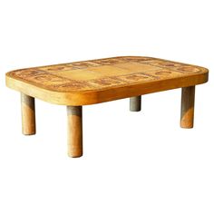 a wooden table that has some kind of design on it