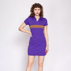 Vintage 90s sporty purple polo mini dress by Express with a colorful striped panel on the chest.  Measurements and Condition: Fits like: Labeled small Fabric: Polyester with poly/cotton trim Brand: Express Tricot Condition: Excellent Length: 34" Chest: 35" to 38" Waist: 30" to 33" Hips: 38" to 42" Shoulders (seam to seam): 14" Sleeve: 6" Shown on a 5'8" model with measurements of 34"-26"-37", usually wears a size small. See our FAQ for more info on sizing and condition ratings. Purple Fitted Collared Dress, Fitted Purple Collared Dress, Retro Striped Mini Dress, Fitted Short Sleeve Dress With Striped Collar, Retro Mini Length Purple Dress, Retro Purple Mini Dress, Shirtdress, Retro Look, Dress Clothes For Women