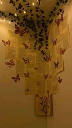 the butterflies are flying over the open book on the wall above the bookshelf