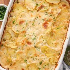 a casserole dish with potatoes and parsley