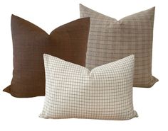 three pillows in different colors and patterns on a white background, each with a checkered pattern