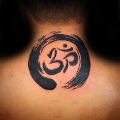 the back of a man's neck with an omen symbol tattoo on it