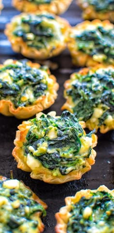 spinach and cheese quiche cups on a baking sheet