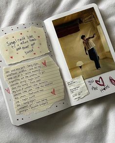 an open book with writing and pictures on the pages that are covered in sticky notes