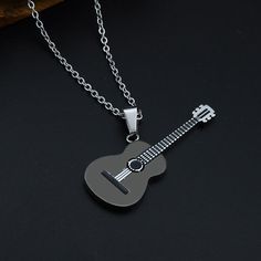 Brand Name: Sam PandaMetals Type: Stainless SteelStyle: Guitarists, Musicians This will be a beautiful and elegant addition to your accessories. A perfect fit for guitarists, guitar lovers, and, musicians. FEATURES: Made up of stainless steel material Intricate details Non- scratchable material Permanent color contrast Unisex Perfect gift for guitarists and gifting occasions Available in 3 colors. Get yours today for the best price at Guitarmetrics. We use encrypted SSL certificates For 100% sec Guitar Necklace, Guitar Jewelry, Guitar Pendant, Steel Guitar, Guitar Lovers, Music Jewelry, Wallpapers Iphone, Stainless Steel Pendant, Cool Necklaces