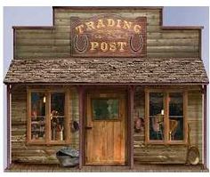 an old fashioned wooden post office sitting on the side of a road