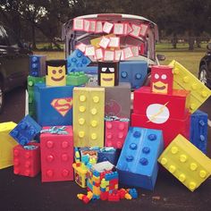 a bunch of legos that are sitting on the ground in front of a car