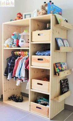 a wooden shelf with baskets and clothes on it