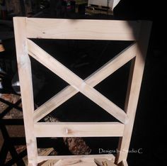 a wooden chair sitting on top of a hard wood floor