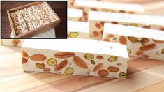 four bars of soap with nuts and pistachios on them