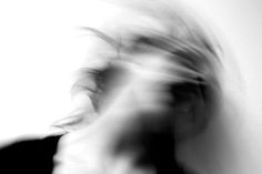 blurry photograph of woman in black and white