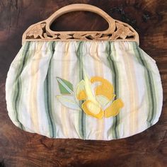 Banana Republic Handbag With Wood Carved Handles, Yellow, Beige, Green, And Cream Stripes With Embroidered Flowers. Adorable Accessory For Any Wardrobe. The Perfect Bag For Brunch Or Lunch!! 15” From Left To Right 12” From Top To Bottom Of Bag. Interior Zip Pocket Retail $60.00 Plus Tax Wooden Handle Bag, Floral Handbags, Yellow Beige, Black Leather Crossbody Bag, Top Handle Handbags, Wood Carved, Linen Bag, Black Leather Bags, Satchel Handbags