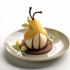 a plate topped with a chocolate covered pear