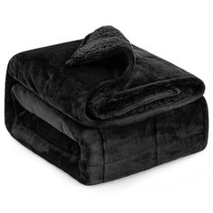 two blankets are folded on top of each other, one is black and the other is gray