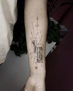 a person's arm with a tattoo on it that has geometric shapes and lines