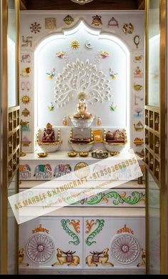 an ornately decorated cabinet in the entry way to a room with white walls and gold trimmings