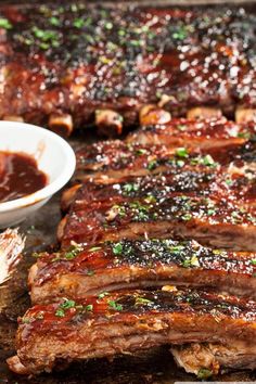 barbecue ribs with sauce and parsley on the side, ready to be cooked in the oven