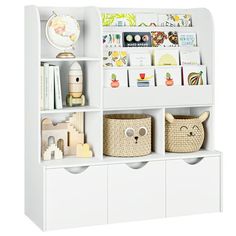 a white book shelf filled with books and toys