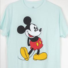 Brand New With No Tags, No Defects On Item. Classic Mickey Logo On The Front. Color Is Mint Green Size: Medium 60%Cotton 40%Polyester Measurments (In Inches) Sleeve: 8.5 (Shoulder Seam To The End Of The Sleeve) Width: 20 (Armpit To Armpit) Length: 28 (Back Collar To Hem) Disney Green Crew Neck T-shirt, Green Disney Cotton T-shirt, Disney Green T-shirt With Graphic Print, Green Disney Graphic Print T-shirt, Playful Cotton Mickey Mouse T-shirt, Fun Mickey Mouse T-shirt For Disney Fan Events, Disney Green T-shirt With Crew Neck, Green Disney Crew Neck T-shirt, Mickey Mouse T-shirt For Disney Trips