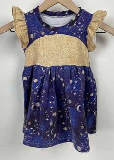 Beautiful Boutique Girls Space themed dress. Size 6 Years. We wore for a space party. Preowned in Very good condition some wash wear. Brand is faded on inside. Please zoom in / reference the photos carefully to the quality of the exact product you will receive. Space Themed Dress, Moon Milk, Gold Galaxy, Space Planets, Stars Moon, Space Party, Girls Boutique, We Wear, Dress Blue