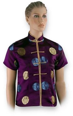 - This Gold and Blue Shou Purple Chinese Shirt exudes a super luxe look with its deep shade of purple, gold and royal blue accents of the Chinese symbol for Shou, and matte gold Chinese button knots! - Processing Time: 1 to 2 Business Days (Excludes Shipping Time) - Made of 55% Rayon, 45% Polyester - Dry-clean recommended - Mandarin collar - Short sleeves - Button-down style - Chinese button knot closure - Hemline hits at the hips - Available in women's sizes. - Imported from China. Ships from P Gold Short Sleeve Tops For Formal Occasions, Fitted Blue Top With Stand Collar, Festive Long Sleeve Purple Top, Traditional Fitted Purple Top, Fitted Traditional Purple Top, Festive Gold Short Sleeve Top, Elegant Purple Festive Top, Elegant Purple Top For Festive Occasions, Elegant Festive Purple Top