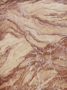 the marble is brown and tan with white streaks