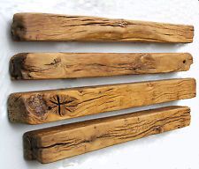 four pieces of wood that have been carved into the shape of crosses on each side