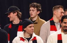 a group of young men standing next to each other