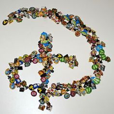 a peace sign made out of many different types of buttons