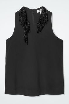 Debuted on the NYFW runway, this top lends a polished refinement to eveningwear looks. Crafted from NAIA™ crepe, it's designed in a halterneck silhouette and embellished with asymmetric beaded fringing. Style it with tailoring for a formal tone. Relaxed fitZip closureNAIA™ cellulose acetate is a fully traceable cellulose acetate fiber made from sustainably sourced wood pulp, using a lower environmental impact process  Shell: 74% NAIA™ cellulose acetate, 26% Viscose. Lining: 55% ECOVERO™ Viscose, Belted Cape, Nyfw Runway, Women Magazines, Cellulose Acetate, Winter Coats Jackets, Denim Coat, Environmental Impact, Blouse And Skirt, Denim Outfit