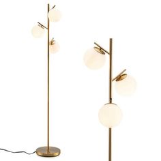 three brass and glass floor lamps on white background