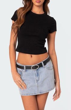 Be ready for the everyday and every party in this basic T-shirt cut from stretchy cotton jersey in a cool cropped silhouette. Crewneck Short sleeves 95% cotton, 5% spandex Machine wash, dry flat Imported Stretch Crew Neck Crop Top In Edgy Style, Edgy Stretch Crew Neck Crop Top, Trendy Cropped Stretch T-shirt, Edgy Fitted Cropped T-shirt With Short Sleeves, Trendy Black Cotton Cropped T-shirt, Edgy Fitted Crop Top T-shirt, Black Cotton Crop Top T-shirt, Black Fitted Cropped T-shirt In Cotton, Fitted Black Cropped Cotton T-shirt