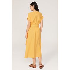 Yellow cotton (100% Cotton). Wrap. Short sleeves. V-neck. Tie closure. 50.5" from shoulder to hemline. Imported. V-neck Tie Waist Dress For Daywear, Cotton V-neck Belted Dresses, Belted V-neck Daywear Dresses, Summer V-neck Relaxed Fit Dress, Belted V-neck Dress For Summer, Relaxed Fit V-neck Dress With Tie Waist, Belted V-neck Midi Dress, Summer Dresses With Notched Neckline For Daywear, Spring Cotton V-neck Dress With Short Sleeves