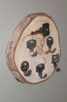 a piece of wood that has some keys in it and is hanging on the wall