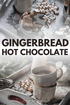 gingerbread hot chocolate is on a tray next to some cookies and other food items