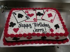 a birthday cake with playing cards on it