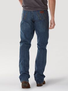 COMFORTABLE, CLASSIC, AND A LITTLE COUNTRY Wrangler® Retro® jeans are a modern take on our authentically Western jeans. Made for country rock stars, rodeo ropers, and those who just happen to have great taste, our men's retro bootcut jeans are a versatile style made to suit any occasion. They offer a comfortable mid rise, relaxed fit through the seat and thigh, and a leg opening that fits perfectly over your favorite pair of boots. Speaking to our Western heritage with a modern sensibility, our Straight Leg Denim Jeans For Ranch, Western Style Medium Wash Cotton Jeans, Western Style Denim Blue Cotton Bottoms, Western Style Cotton Jeans In Medium Wash, Medium Wash Denim Jeans For Ranch, Medium Wash Jeans With Pockets For Rodeo, Rugged Denim Bottoms For Rodeo, Western Denim Blue Jeans With Five Pockets, Western Style Denim Blue Jeans