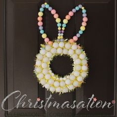 an easter wreath hanging on the front door