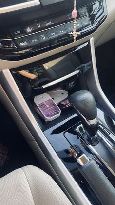 the interior of a car with various items in it