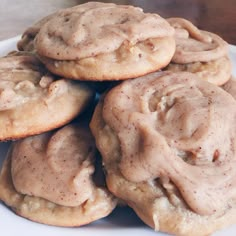 some cookies are stacked up on a white plate