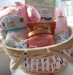 a basket filled with personal care items on top of a table next to a window