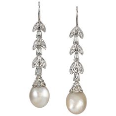 A pair of natural pearl and diamond drop earrings, the two pearls accompanied by Gem & Pearl Lab Report stating to be natural of saltwater origin, each with a diamond-set cap, suspended by a run of tapered baguette diamonds and foliate designed links encrusted with swiss-cut diamonds, the diamonds estimated to weigh a total of 0.6 carats, all mounted in white gold with hook fittings, late hallmarked 18ct gold, London 2019, gross weight 8.4grams, circa 1950. Should you choose to make this purchas Luxury Victorian Pearl Earrings, Pearl Earrings Designs, Lab Report, Romantic Earrings, Pearl And Diamond Earrings, Baguette Diamonds, Jewellery Shop, Bespoke Jewellery, Natural Pearl