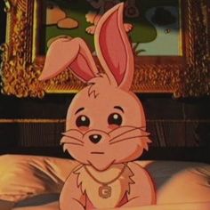 a cartoon rabbit sitting on top of a bed in front of a framed painting behind it